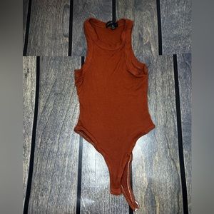 Burnt orange body suit